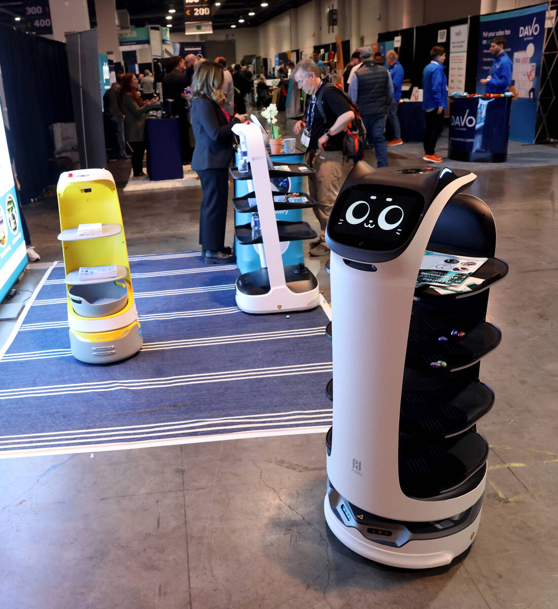 Food and drink delivery robots roam the ToDo Robotics booth at the Bar & Restaurant Expo at ...