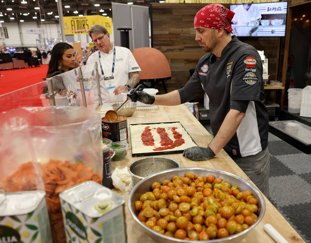 Pizza Artista Massimiliano Saieva of ASR PizzaLab academy prepares a pizza for sampling in the ...