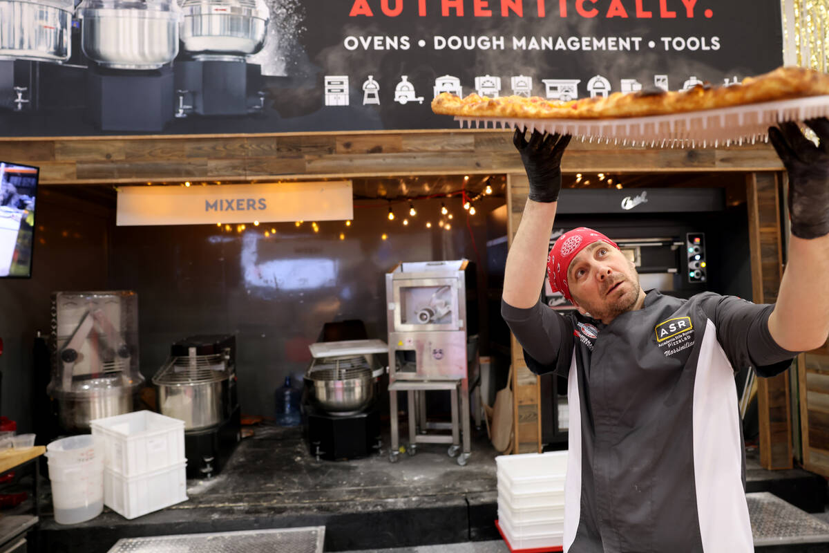 Pizza Artista Massimiliano Saieva of ASR PizzaLab academy prepares a pizza for sampling in the ...
