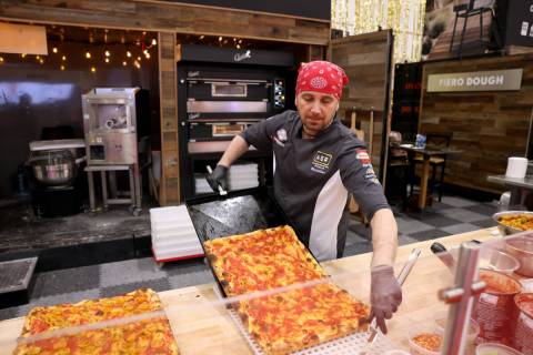 Pizza Artista Massimiliano Saieva of ASR PizzaLab academy prepares a pizza for sampling in the ...