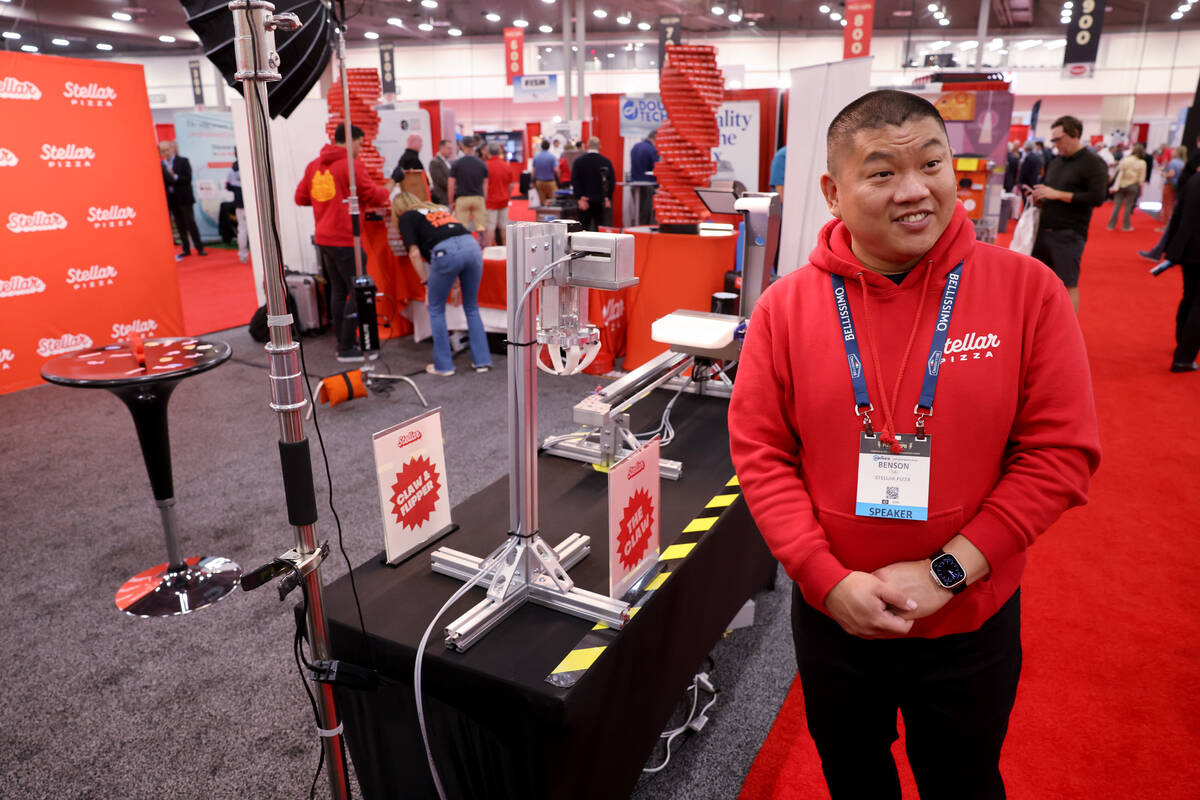 Benson Tsai of Stellar Pizza talks about his robot-made pizza at the International Pizza Expo a ...