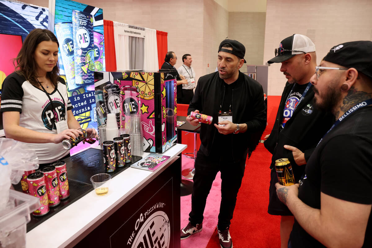 Kevin Klein with Pie Wine of Beverly Hills, Calf., second from left, talks about his product wi ...
