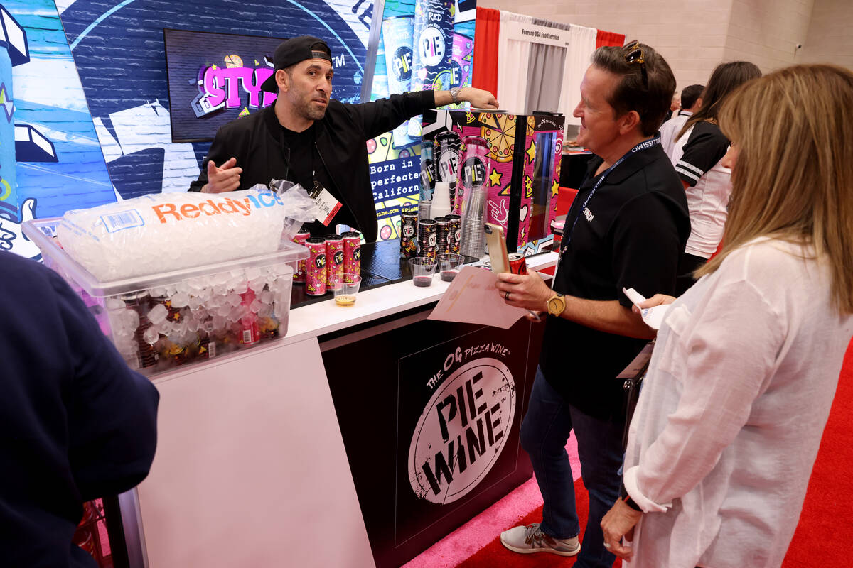 Kevin Klein with Pie Wine of Beverly Hills, Calf., left, talks about his product with Roger Jeh ...