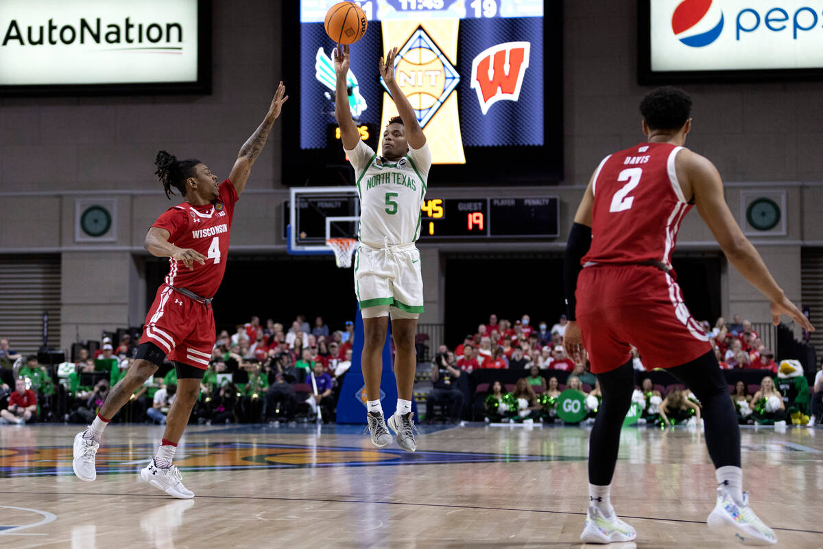 North Texas Mean Green guard Tylor Perry (5) shoots against Wisconsin Badgers guard Kamari McGe ...