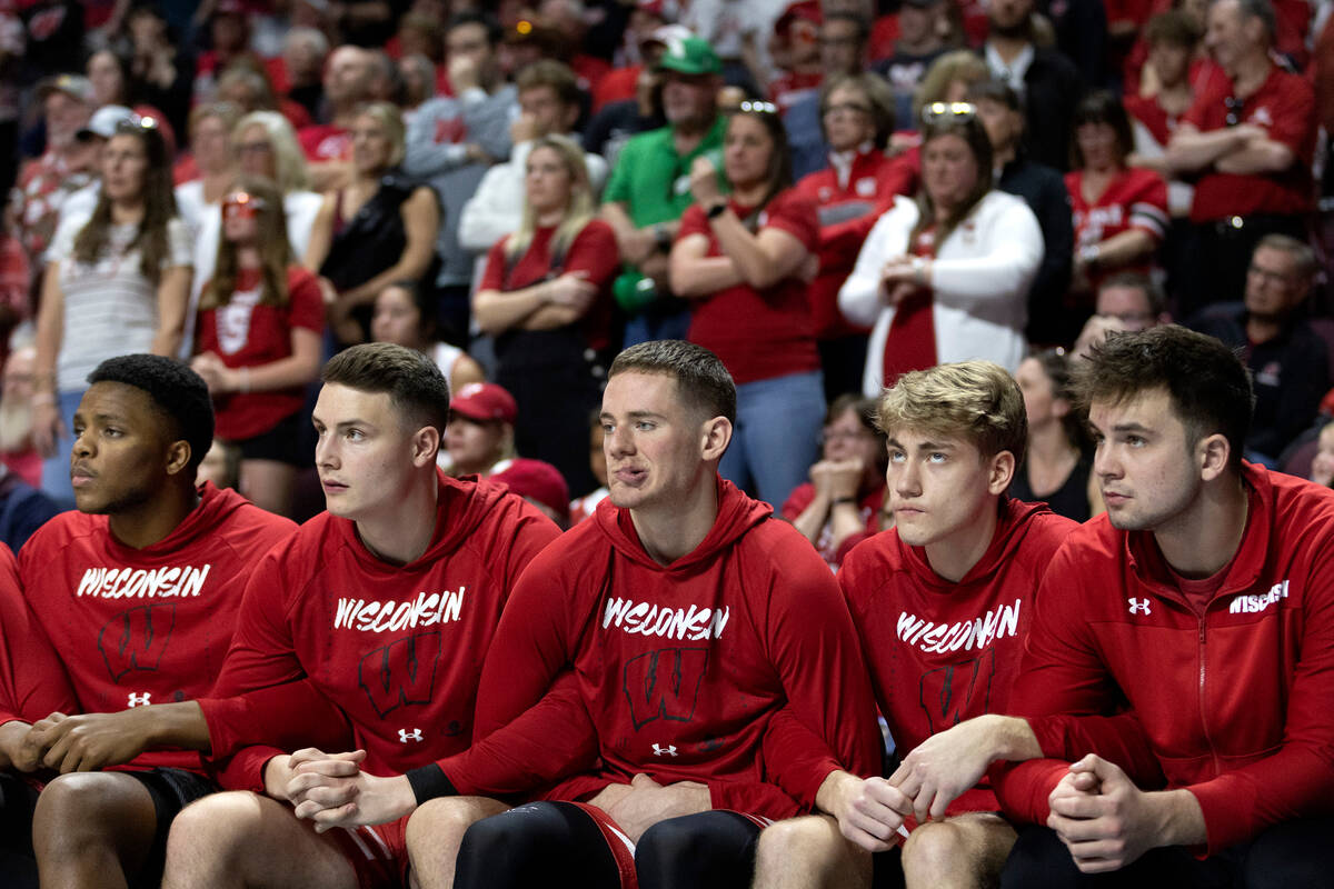 The Wisconsin Badgers bench and fan section watches as their team is up for free throws that co ...