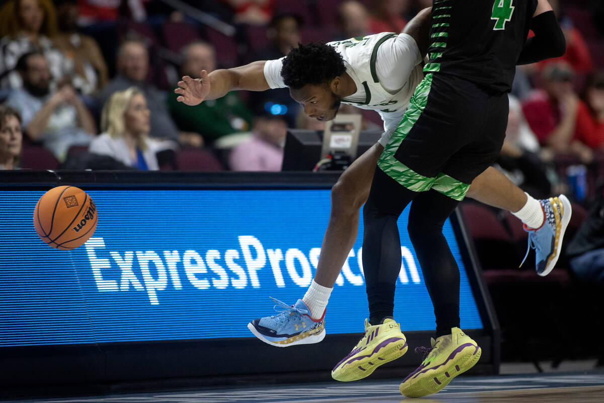 UAB Blazers guard Tavin Lovan (3) dives for the ball against Utah Valley Wolverines guard Trey ...