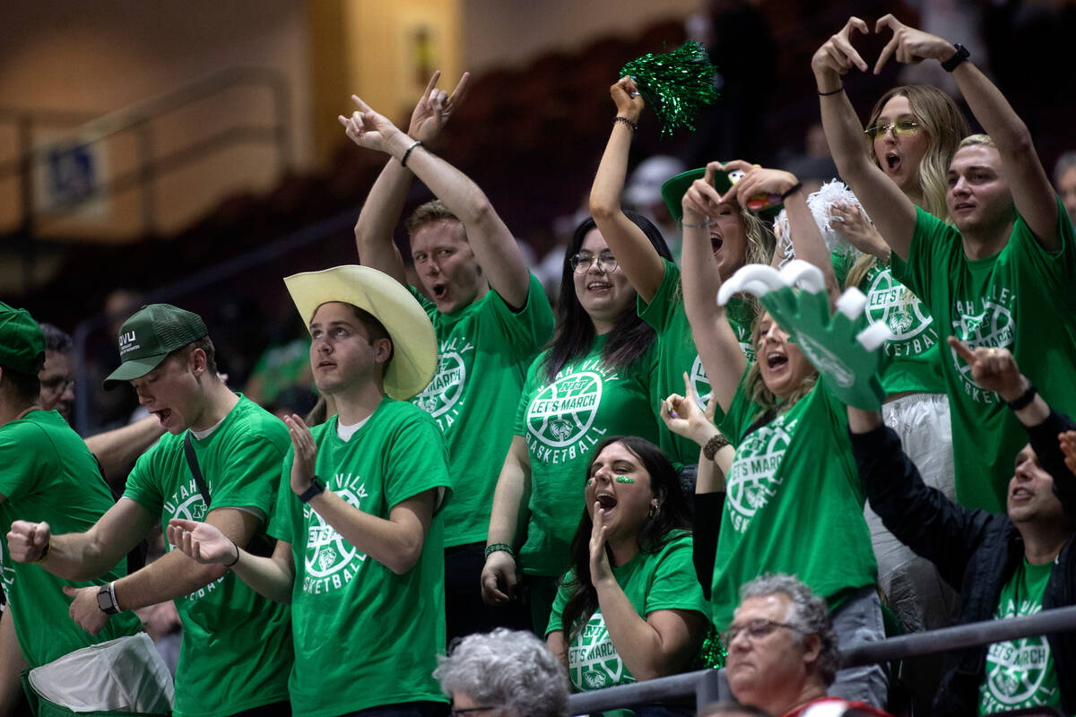 Utah Valley Wolverines fans cheer for their team during the first half in a NCAA college basket ...
