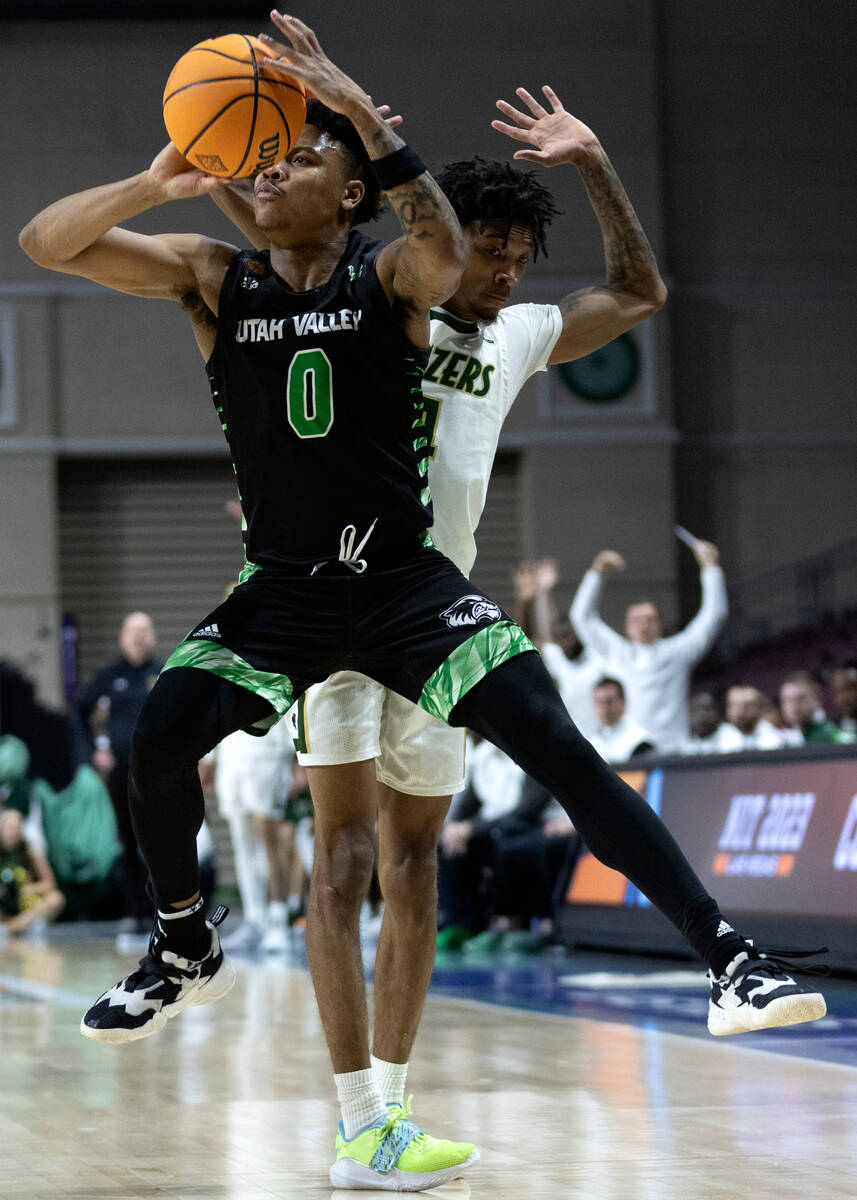Utah Valley Wolverines guard Justin Harmon (0) attempts to beat the shot clock while UAB Blazer ...