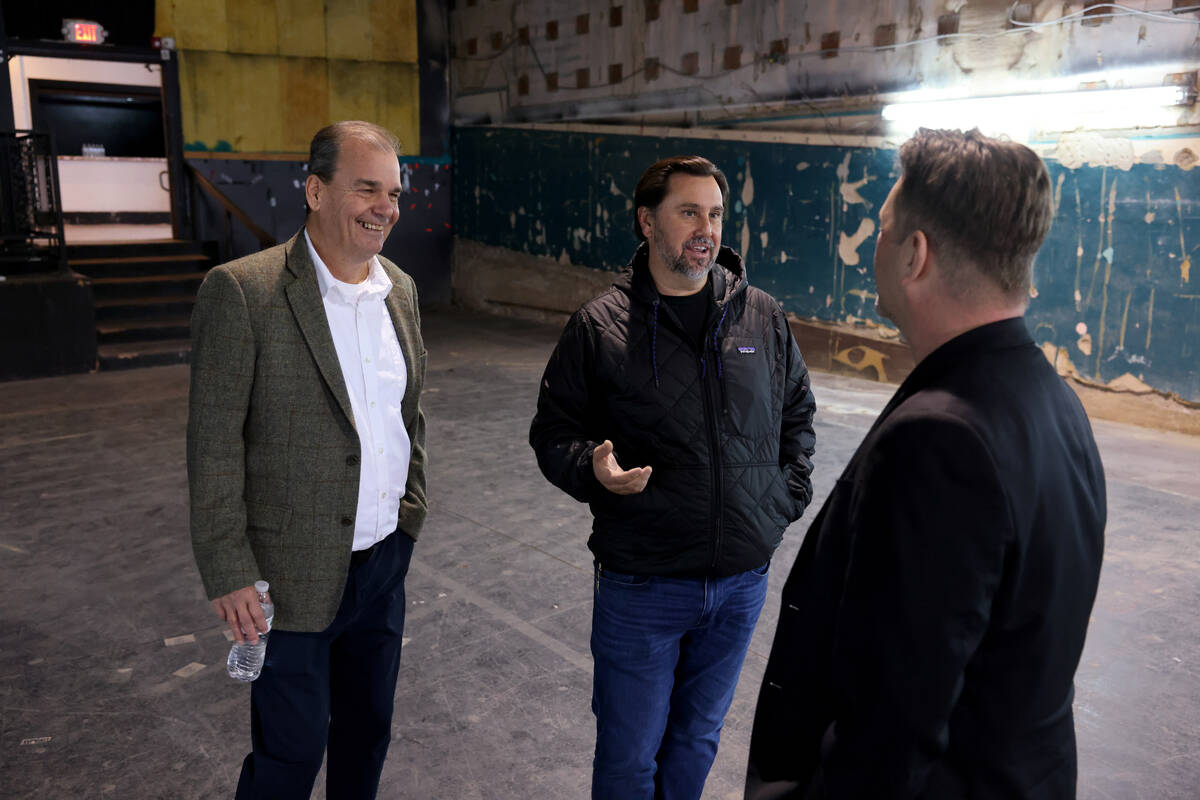 Developer J Dapper, owner of the Huntridge Theater, center, meets with architect Brett Robillar ...