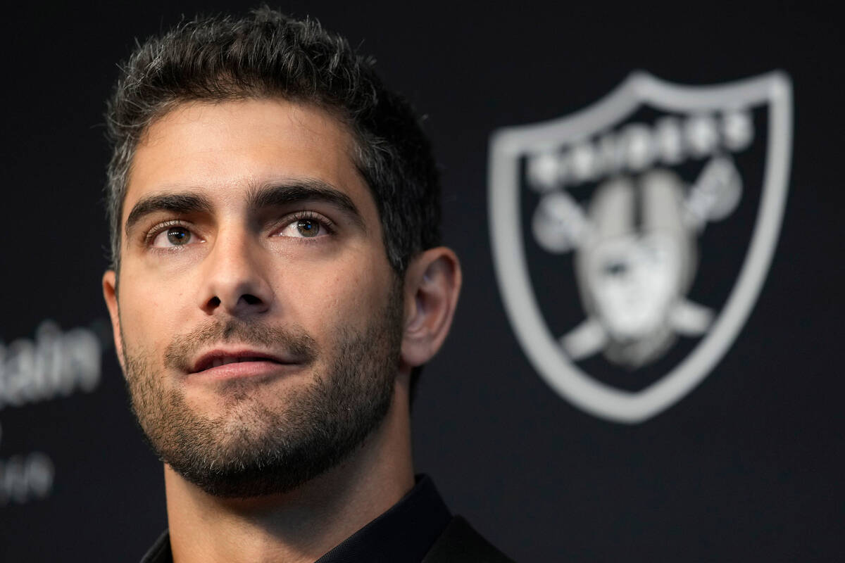 Las Vegas Raiders quarterback Jimmy Garoppolo takes questions at a news conference Friday, Marc ...