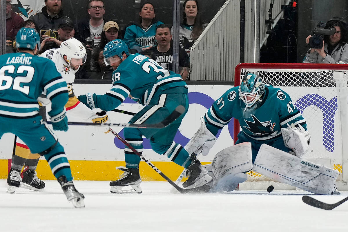 Vegas Golden Knights right wing Michael Amadio, second from left, scores past San Jose Sharks g ...