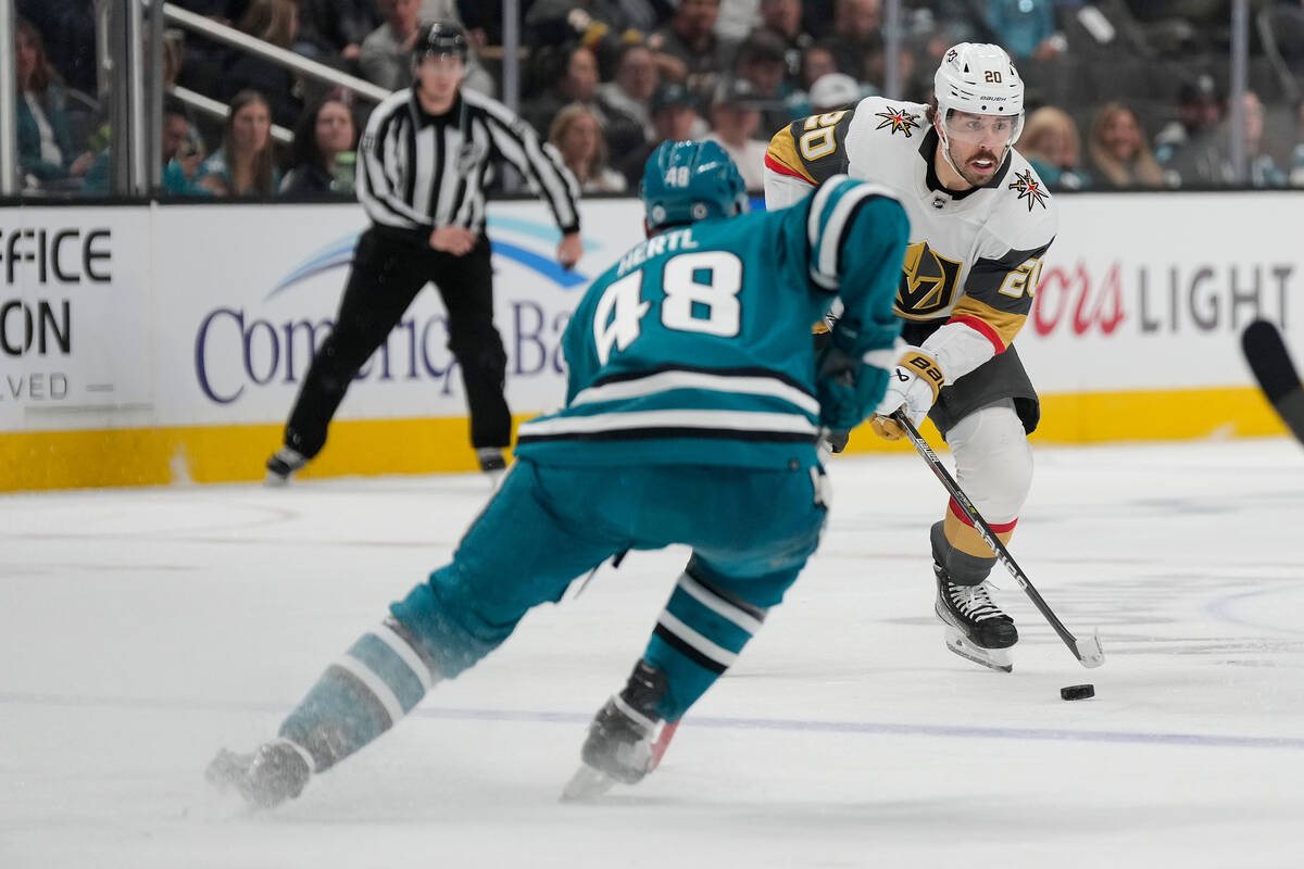 Vegas Golden Knights center Chandler Stephenson (20) moves the puck up the ice against San Jose ...