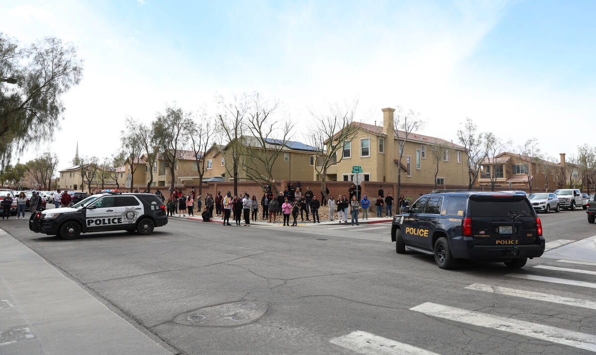 Parents wait outside of Shadow Ridge High School as Las Vegas police investigate after a threat ...