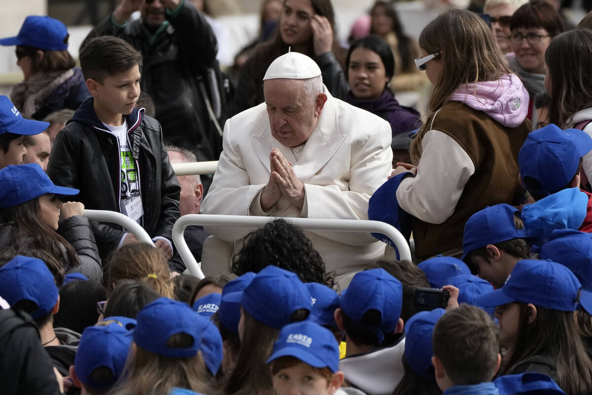 Pope Francis meets children at the end of his weekly general audience in St. Peter's Square, at ...