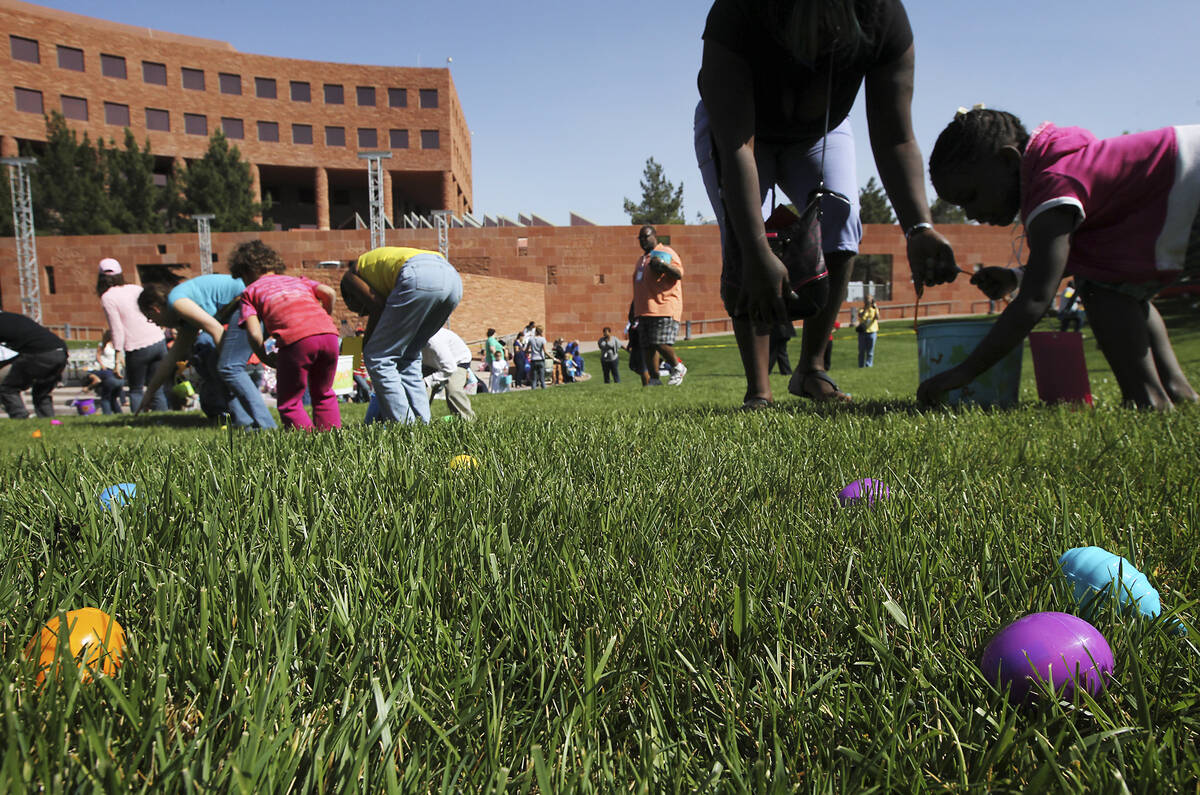 Local foster care children and their foster parents take part in the annual Easter egg hunt at ...