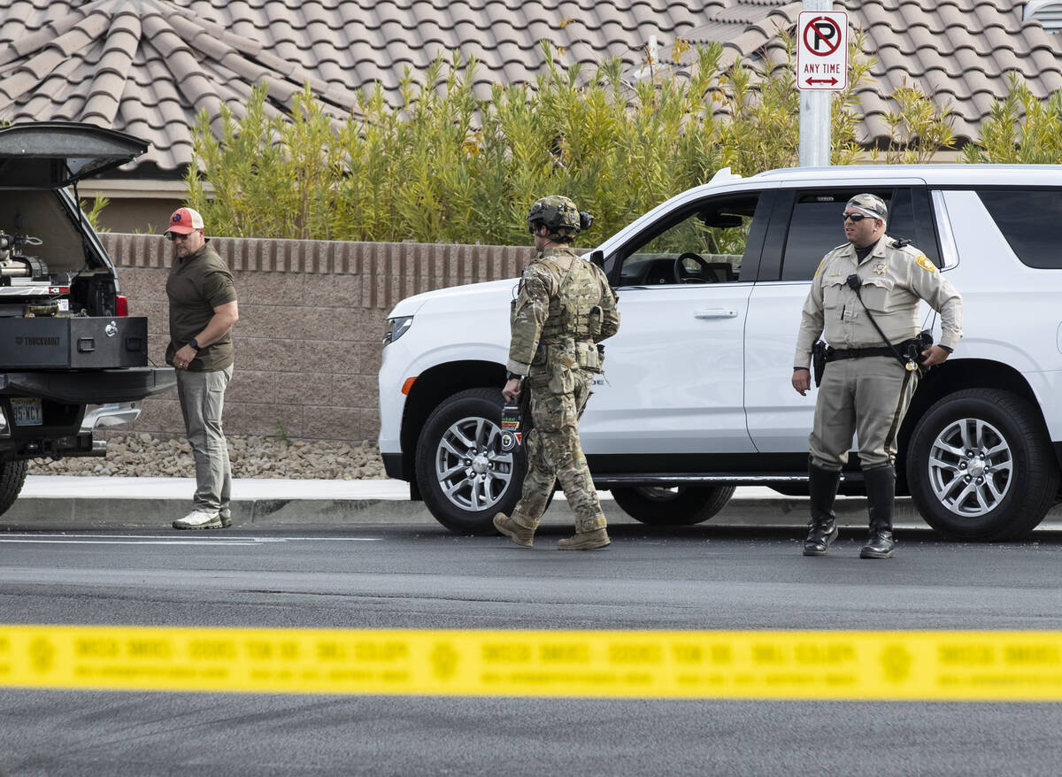 A SWAT team arrives to provide assistance as FBI agents negotiated with Matthew Beasley, who la ...