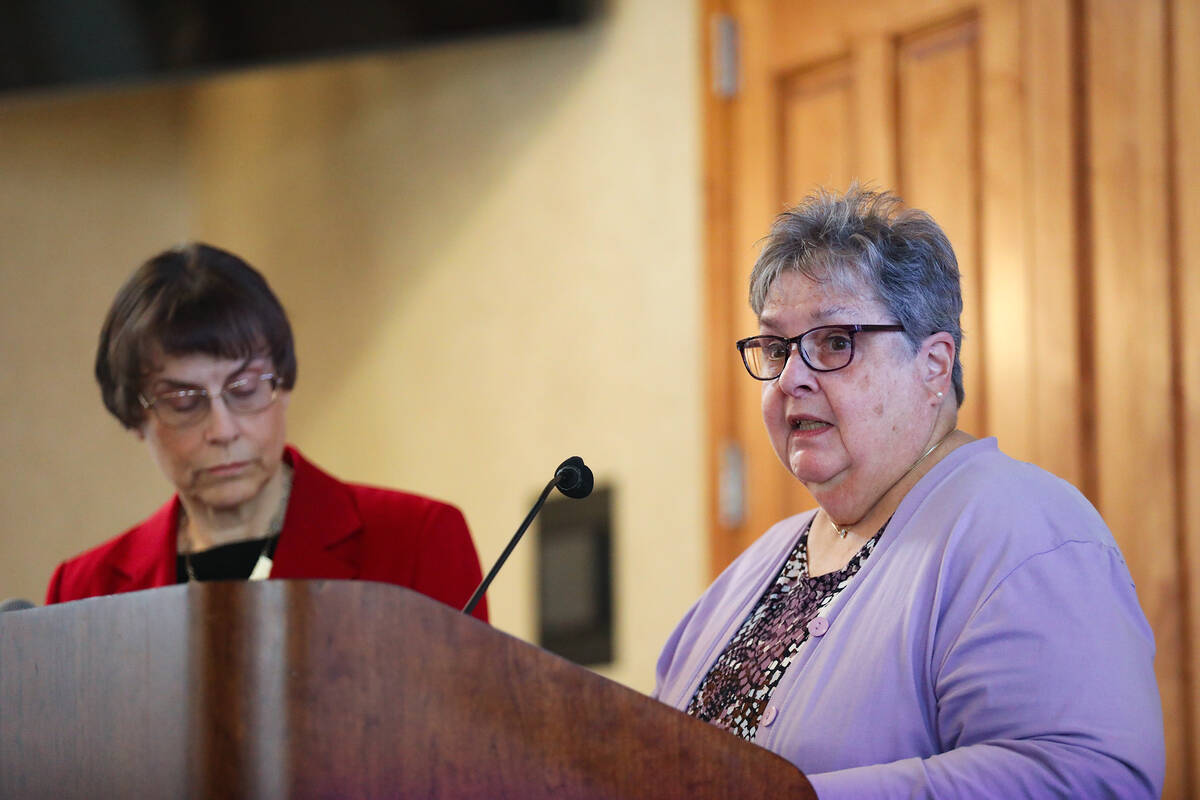 Lillian Polus Gerstner addresses guests next to Esther Finder at a Seder Passover meal at the F ...