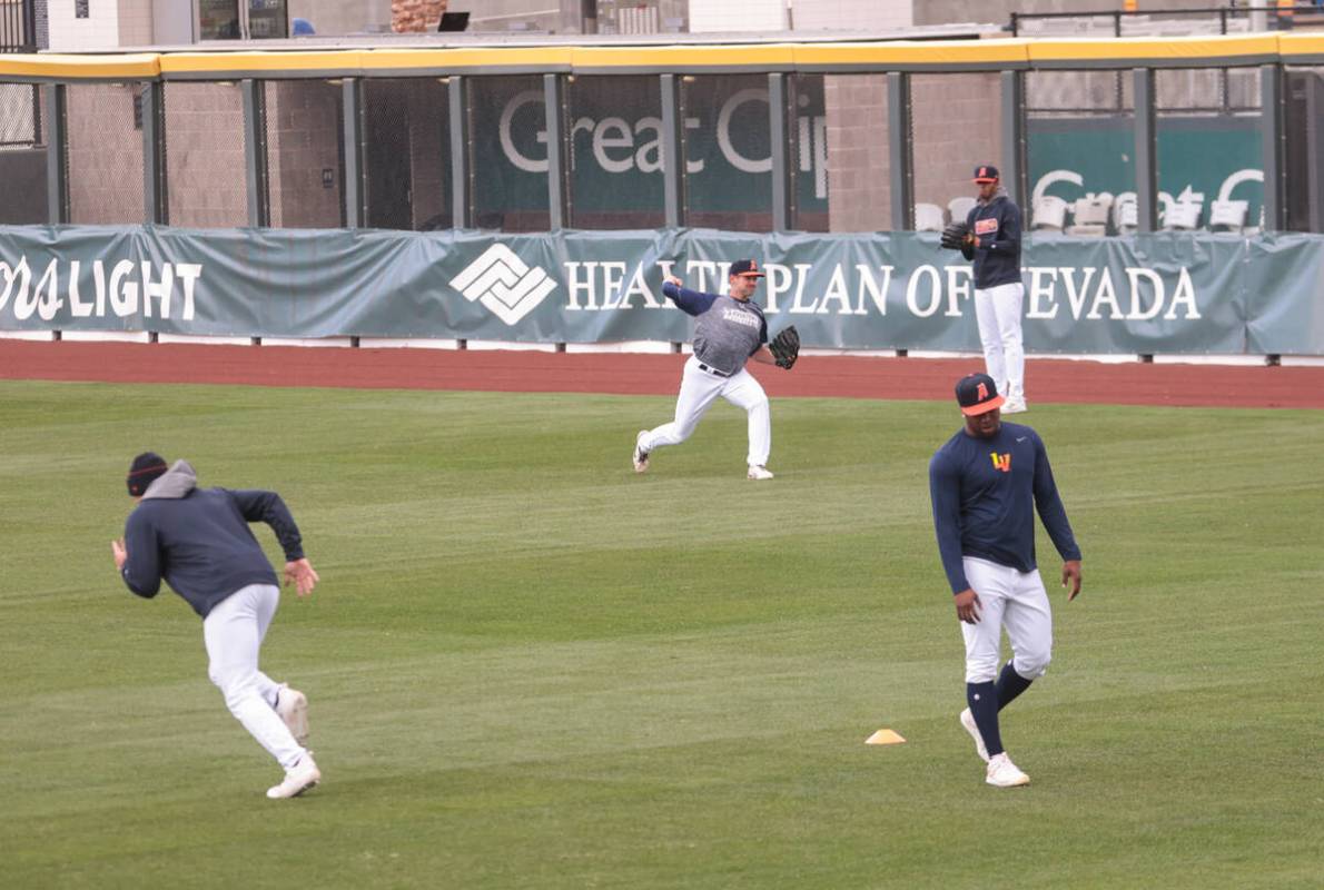 Las Vegas Aviators pitcher Garrett Acton, center, pitches during a media day practice at Las Ve ...