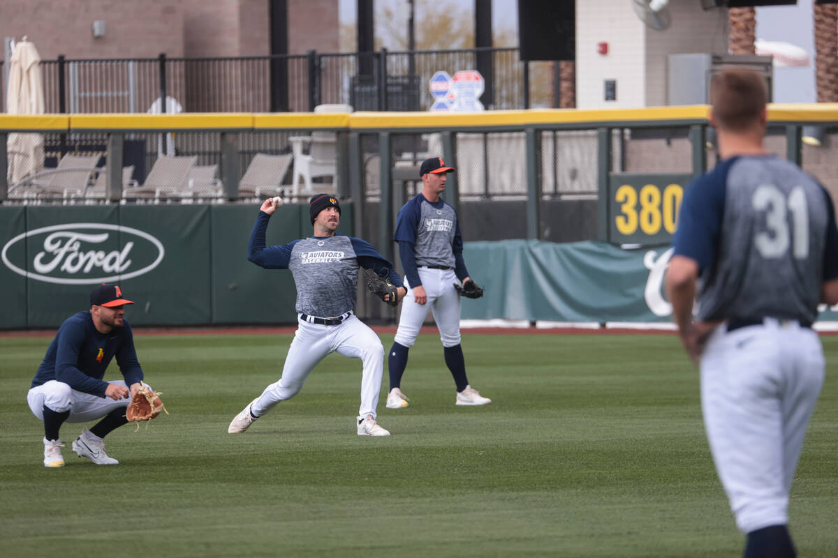 Las Vegas Aviators pitcher Bryce Conley, second from left, pitches during a media day practice ...