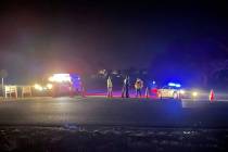 Emergency responders are seen near a site where two military helicopters crashed Wednesday nigh ...