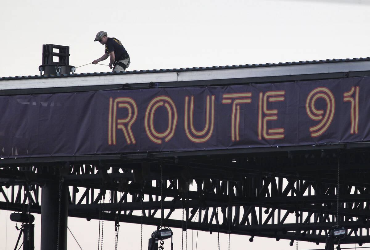 The FBI investigates atop of the Route 91 Harvest main stage at the Las Vegas Village festival ...