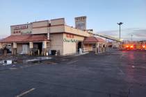 A ladder truck can be seen extending its aerial onto the roof of China Mama, a popular restaura ...