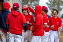 Liberty runner Cole Neilson is congratulated on a score versus Spring Valley during the third i ...