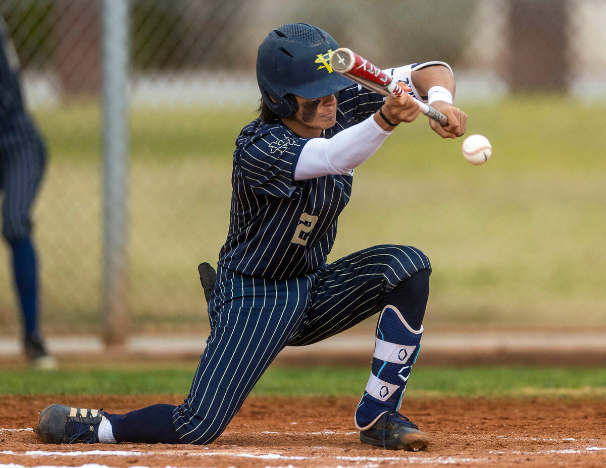 Spring Valley batter Cameron Pienta bunts a pitch versus Liberty during the third inning of the ...