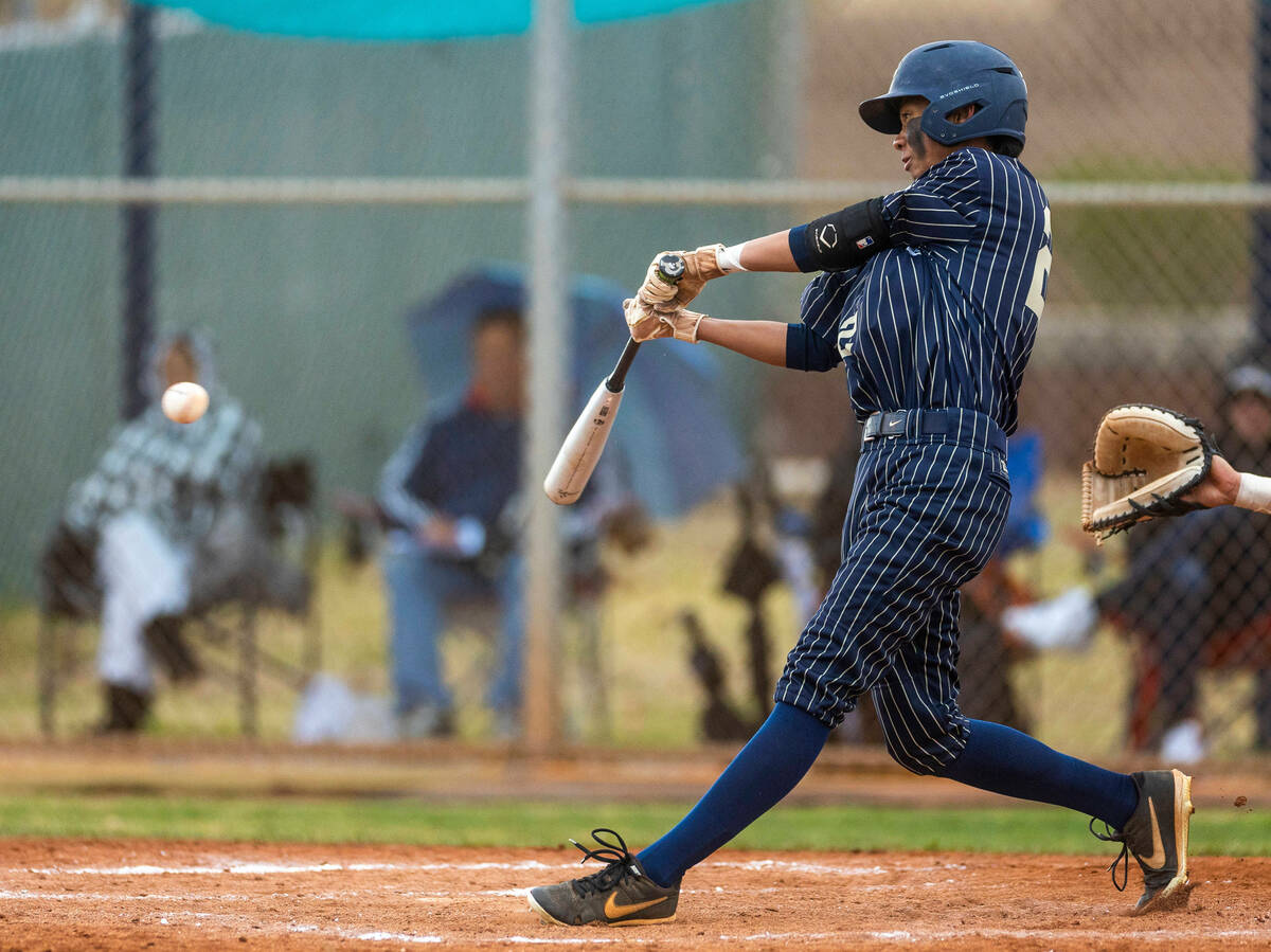Spring Valley batter Royce Ogawa connects on a pitch versus Liberty during the fourth inning of ...