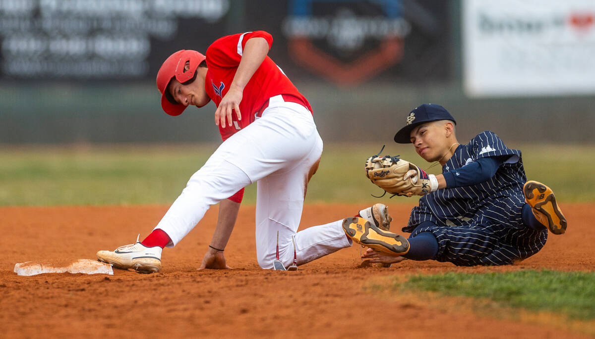 Liberty runner Dominick Rush tags safely as Spring Valley second baseman Eddy Zurita stumbles o ...