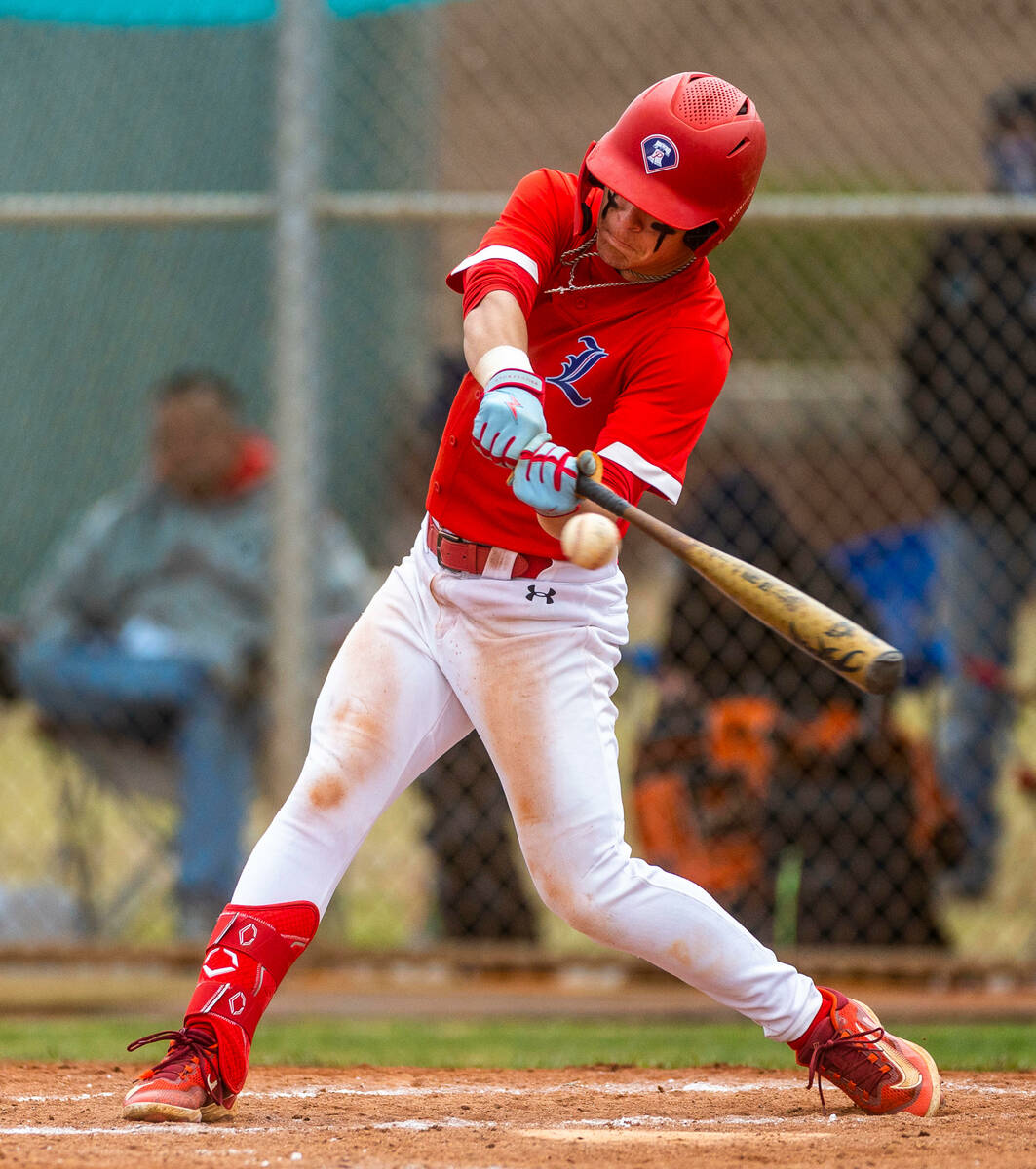 Liberty batter Nicholas Blakeney connects on a pitch versus Spring Valley during the fifth inni ...