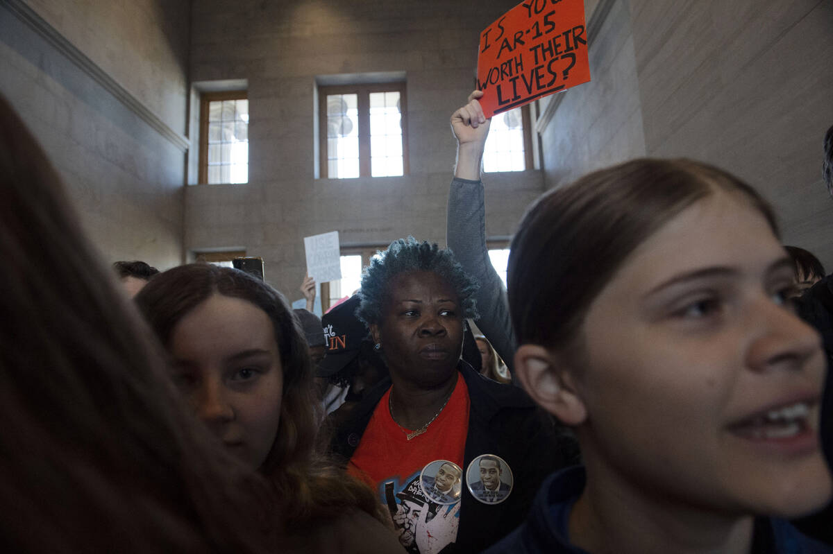 Protesters fill the capitol building as representatives make their way towards the House chambe ...