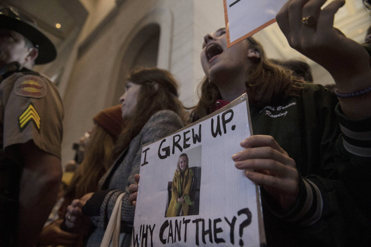 Protesters fill the capitol building as representatives make their way towards the House chambe ...