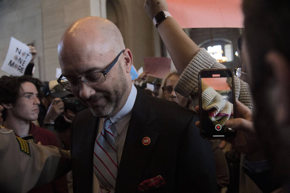 Protesters fill the capitol building as representatives make their way towards the House chambe ...