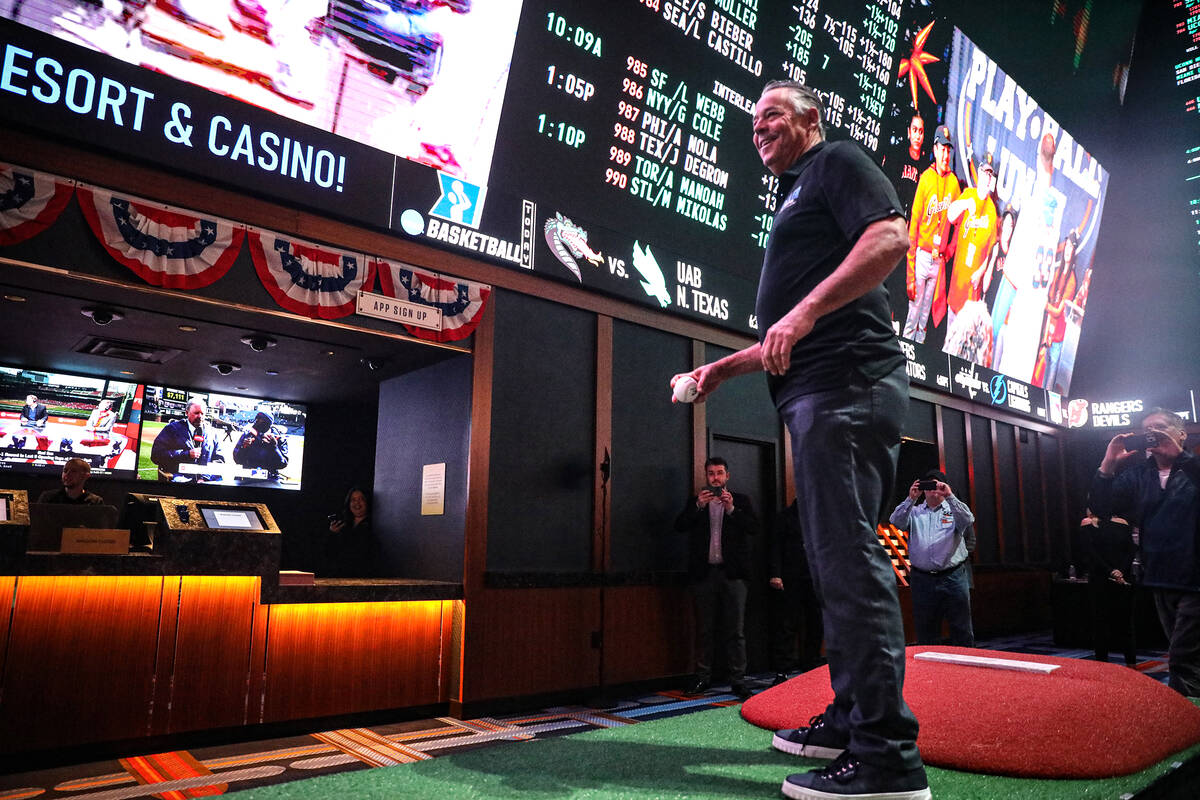 Former MLB pitcher and Las Vegas resident Greg Maddux pitches for opening day of the MLB season ...