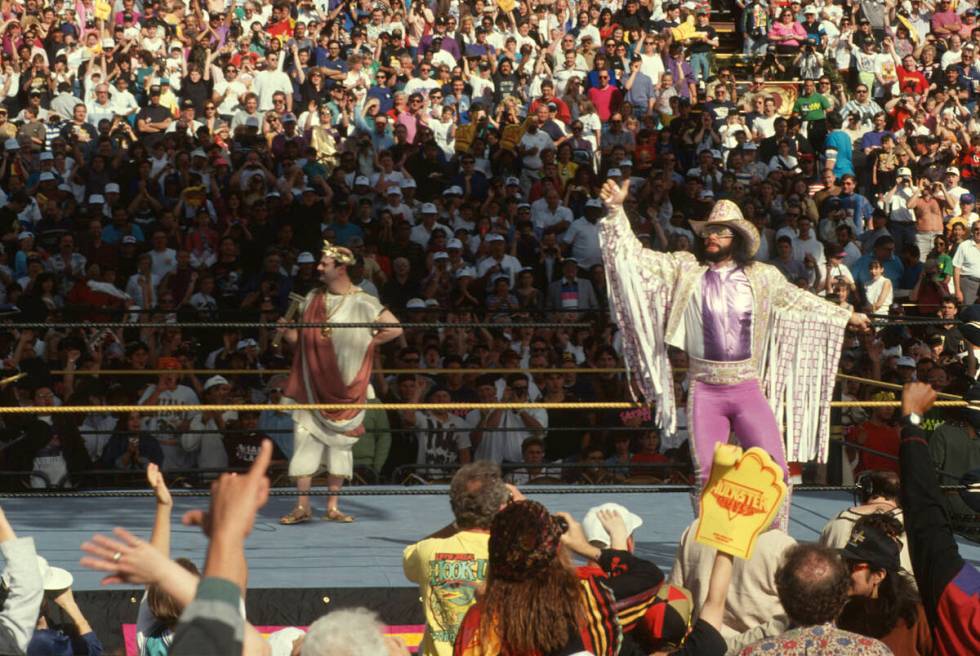 "Macho Man" Randy Savage greets the crowd upon his arrival to the ring. (WWE)