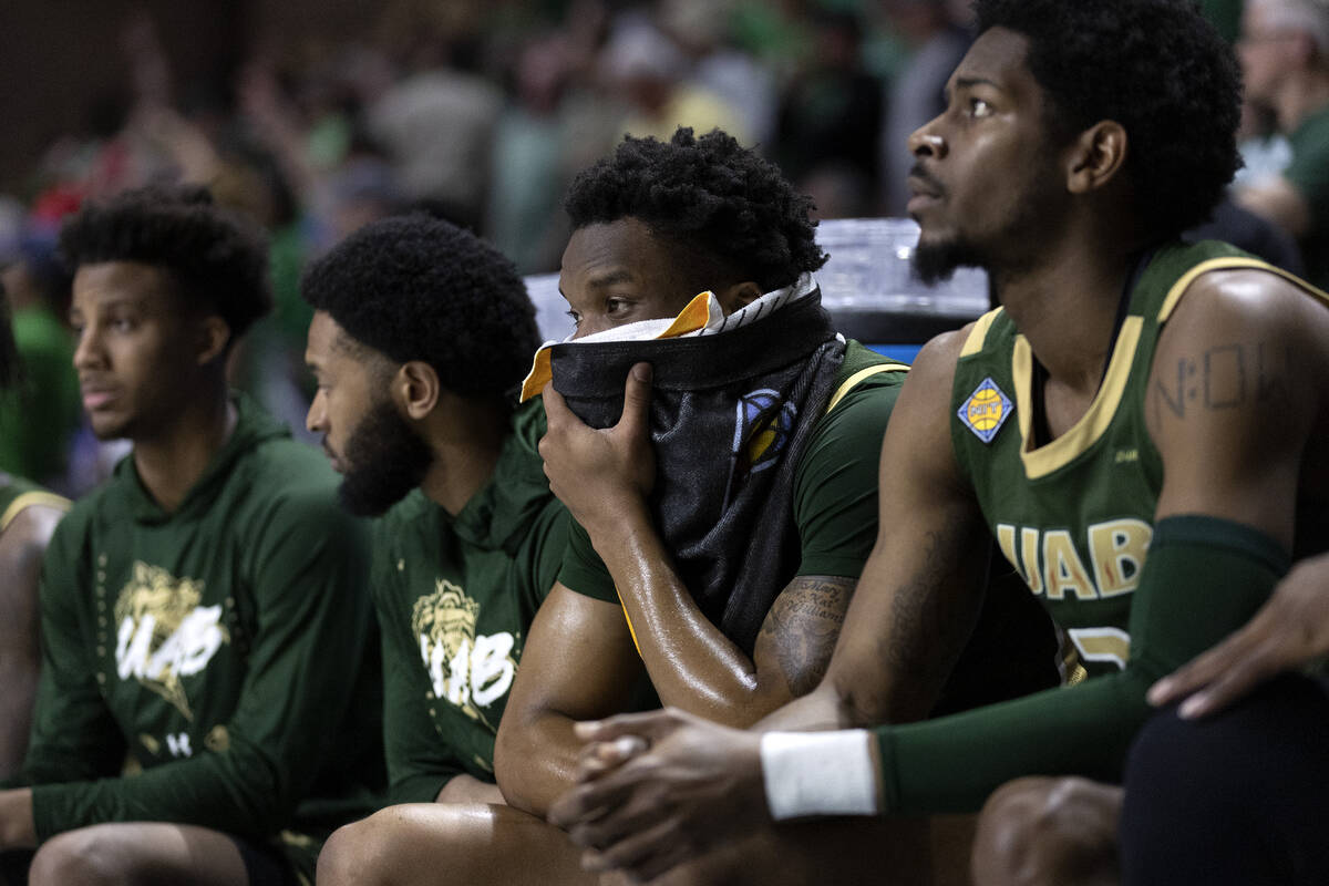 The UAB Blazers bench reacts as their team is losing in the final seconds of a NCAA college cha ...