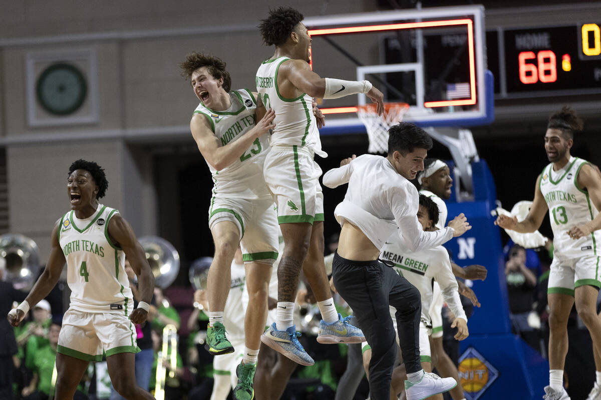 The North Texas Mean Green celebrate as their team wins the National Invitation Tournament coll ...