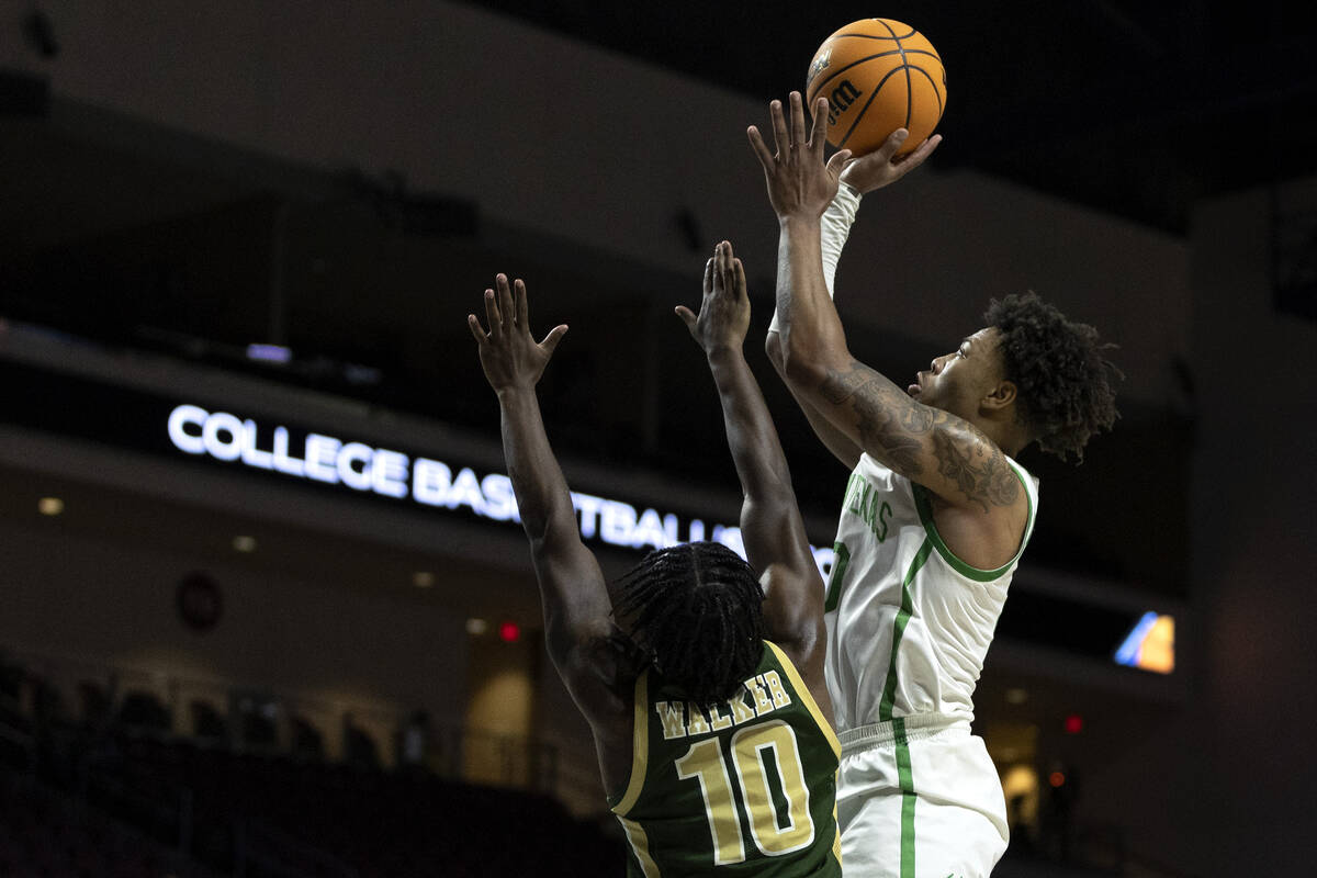 North Texas Mean Green guard Kai Huntsberry (10) shoots against UAB Blazers guard Jordan Walker ...