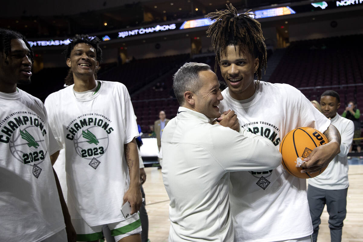 North Texas Mean Green guard Rubin Jones, right, embraces head coach Grant McCasland after thei ...