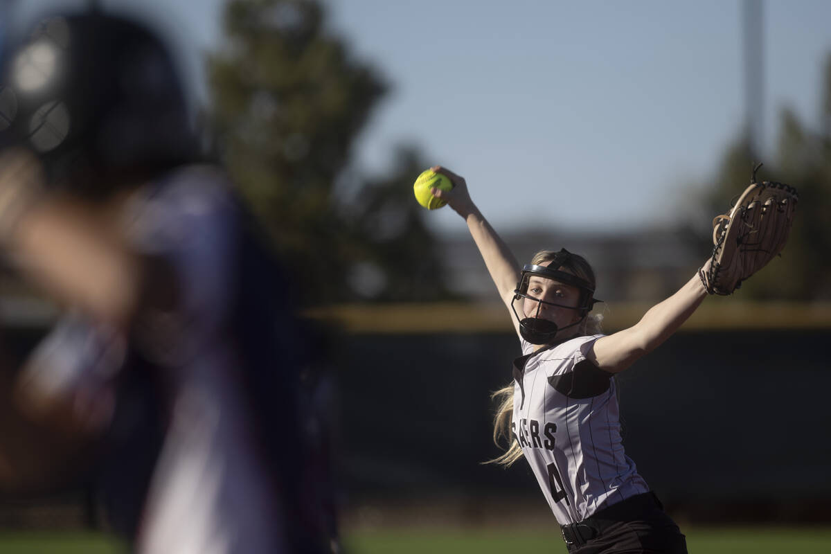 Faith Lutheran’s Jersie McDonald throws to Coronado during a high school softball game a ...