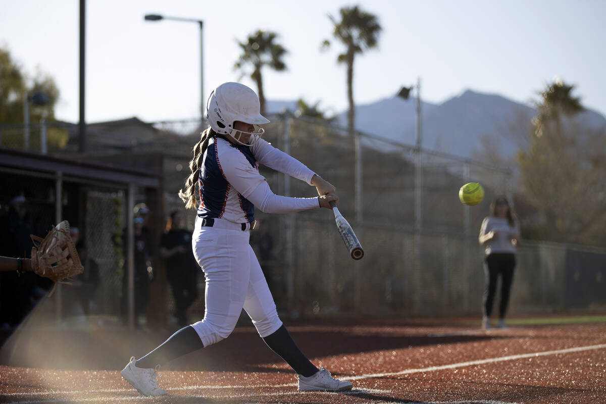 Coronado’s Jasmyn Lara swings at a Faith Lutheran pitch during a high school softball ga ...