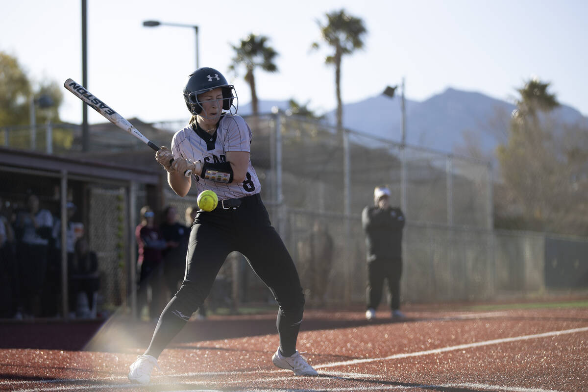 Faith Lutheran’s Kate Whipple is hit by a pitch during a high school softball game again ...