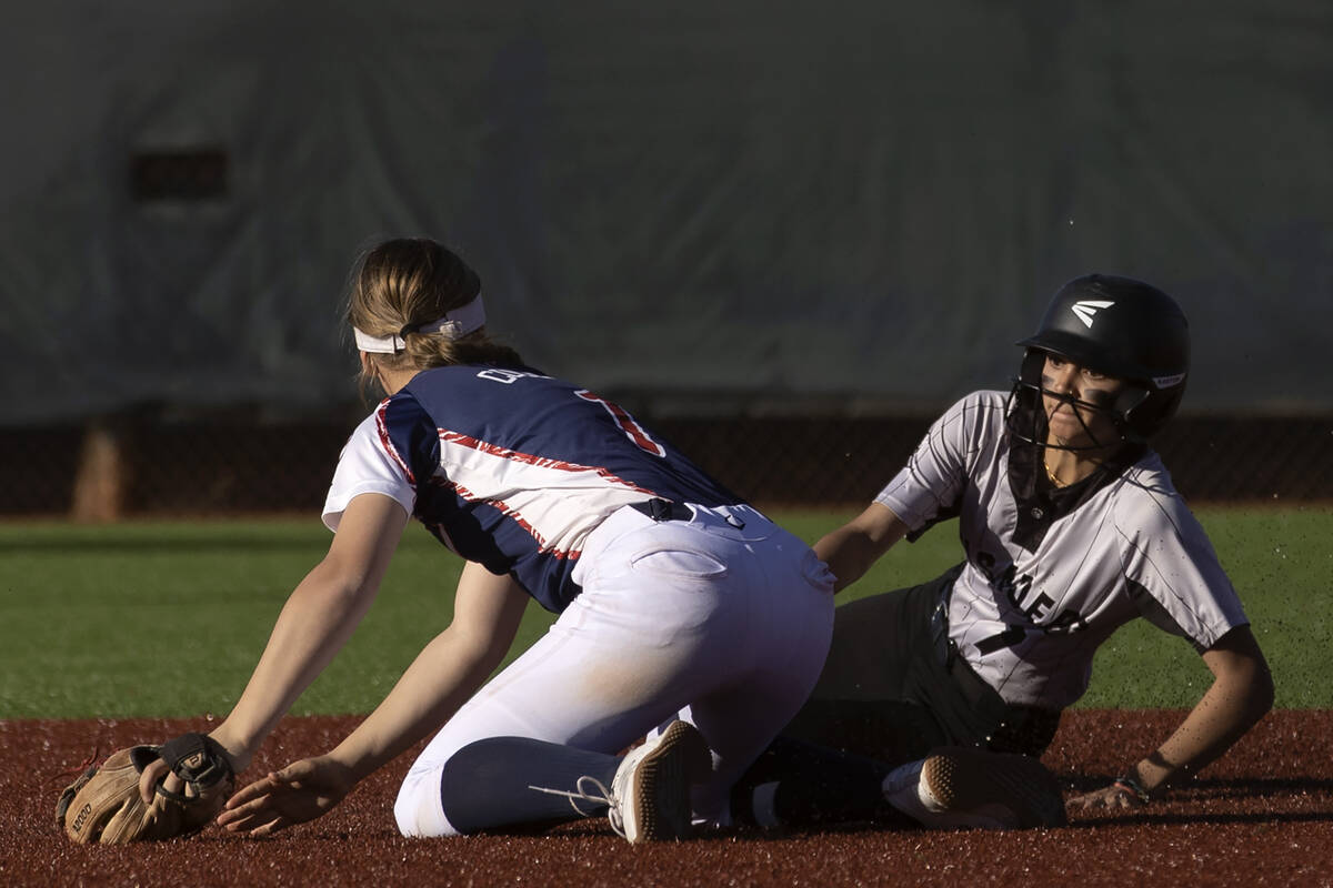 Coronado’s Mayra-Luz Gomez (1) outs Faith Lutheran’s Jillian Molnar (7) at second ...