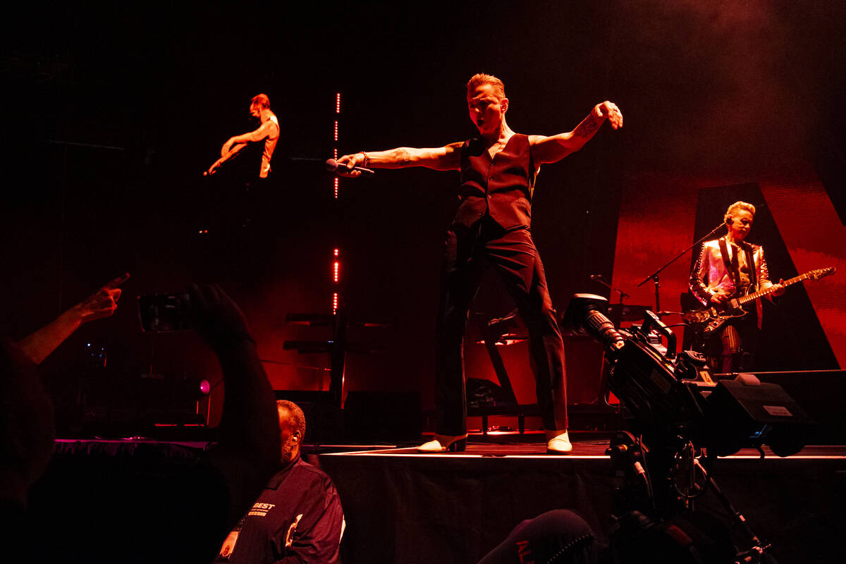 Depeche Mode members Martin Gore,center, Dave Gahan, right, and