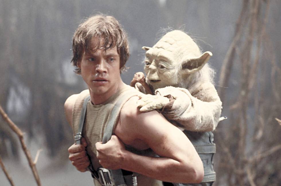 Mark Hamill as Luke Skywalker with Yoda in a scene from "Star Wars Episode V: The Empire S ...