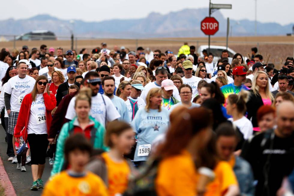 Volunteers, supporters, and wish families attend the Walk for Wishes event at the Town Square i ...