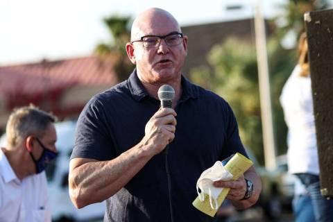 Byron Brooks speaks during a demonstration in support of reopening public schools outside of th ...