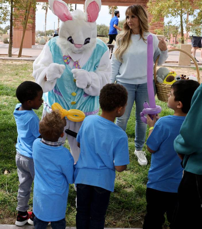 Unidentified foster children meet the Easter Bunny during a foster parent resource fair at the ...