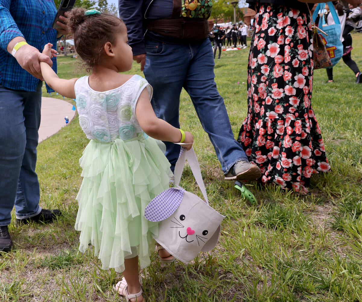 Unidentified foster children collect eggs during a hunt as part of a foster parent resource fai ...